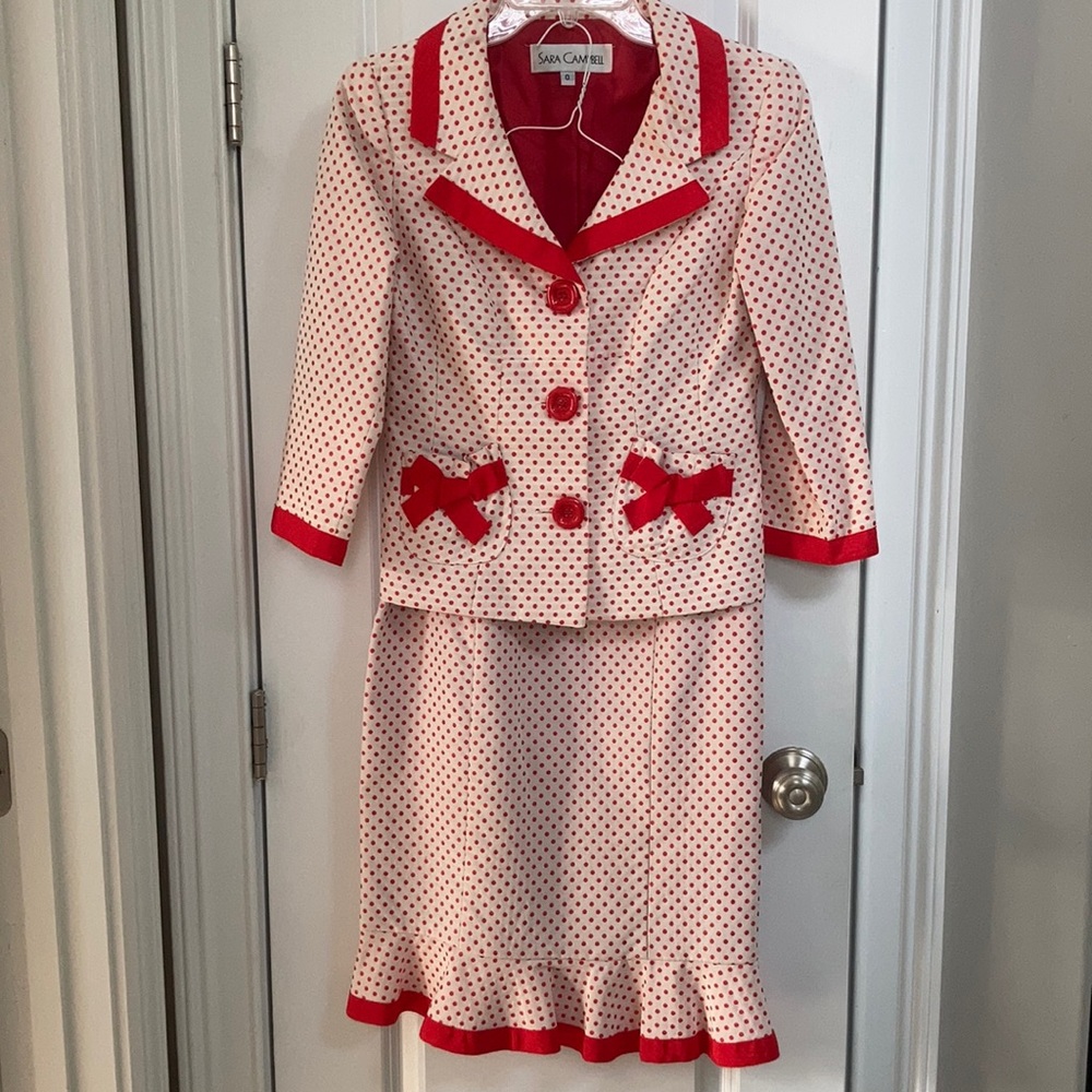 Sara Campbell white with red dots suit